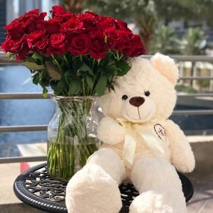 Bouquet with 50 premium red roses in a vase and a large off-white color Teddy Bear (90cm)