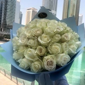 A Bouquet with 50 White Roses in Blue Wrapping
