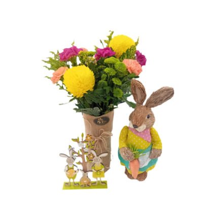 Colorful bouquet in vase with big bunny