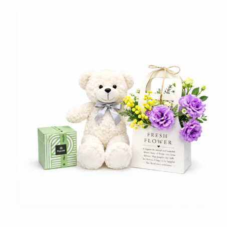 purple breeze arrangement with small teddy and patchi